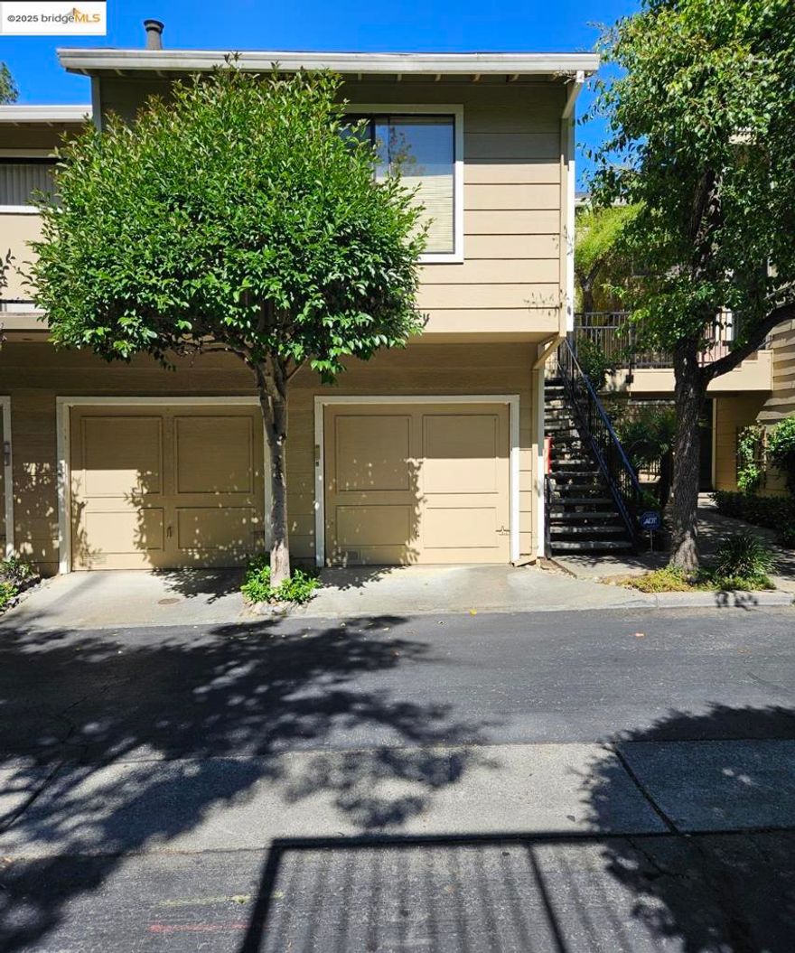 Natural Beauty and an Exceptional Opportunity: Own this one-bedroom, one-bath 787 sqft condo, located in Hayward Hills, renowned for its scenic beauty and nature escapes, a truly remarkable real estate opportunity for those who seek a blend of tranquil suburban living and urban accessibility. This condo, nestled amid the rolling vistas, features an open-concept floor plan between the living, formal dining, and kitchen areas, vaulted ceilings, a cozy wood-burning fireplace, in-unit laundry that includes a washer and dryer, stainless steel appliances, a one-car garage with remote access and extra storage space, and a large, private balcony in an area with beautifully landscaped courtyards and gardens.  This condo is conveniently located near guest parking, the community pool and a hot tub, along with exceptional connectivity throughout the Bay Area to major highways (Interstate 880 and 580), BART, the Oakland International Airport, just a short drive away, and in close proximity to Cal State University, East Bay. Living in Haywood Hills offers the best of both worlds, minutes away from a variety of local shops and eateries coupled with walking trails and well-maintained parks. Whether you are a first-time homebuyer or an investor, this property presents an irresistible invitation.
