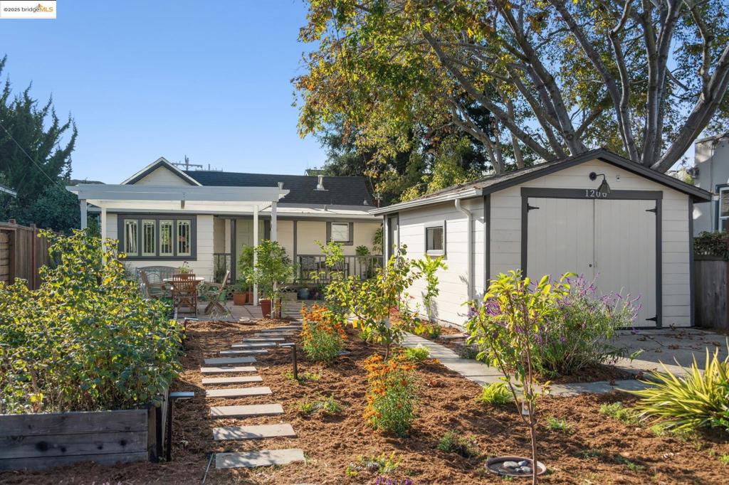 With an ideal North Berkeley, 1200 Cornell is a stone throw from the Westbrae Nursery, Berkeley Bagels, Headlands Brewery, Adego Azul wine bar, and three.one four Pizzeria! Through the private front gate you are greeted by a lush garden teeming with fruit trees, veggie beds, native flowers, and a patio with trellis. Nestled in the garden is this sun-kissed bungalow with original craftsman porch beckoning you to sit and rest a while. Inside is a charming and remodeled one bedroom home. The open floor plan features a spacious eat-in kitchen with stainless steel appliances, quartz countertops, and a sunny breakfast nook. Separate, but seamlessly connected, is the large living room looking out to the garden. Rounding out the main house is the private one-bedroom and cheery remodeled bathroom. Just a few steps away is the detached garage with laundry. With insulated and finished walls, this space makes an ideal home office or potential ADU. Below the home is a large storage room providing space for everything. In 23’, plans were drawn up and permits approved for a larger home. Those plans are available to the buyer if they want to bring the plans to life. Sewer compliant, BESO compliant, $600 pest inspection, newer roof, and so much more!