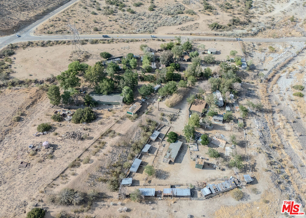 34270 Cheseboro Rd in Palmdale offers a unique commercial investment opportunity with a layout and infrastructure suited for kennel operations, animal boarding, or similar uses. The property includes multiple detached buildings, secure chain-link enclosures, and a network of fenced runs ideal for housing and managing a large number of animals. Utility access, drive-up clearance, and a private entry road make logistics and deliveries efficient. The structures include office or caretaker space, open utility areas, and storage, with room for customization or expansion based on business needs. With its strategic location and existing setup, this property is primed for a buyer seeking a functional site for a commercial animal-related business or similar enterprise.