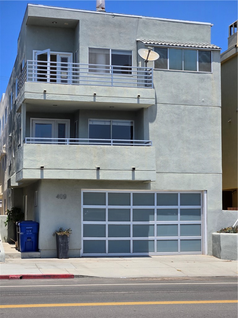 Enjoy beach living at its finest in this spacious and bright tri level townhome steps from the sand. First floor has direct access to a big 3 car garage and a bedroom with small bathroom with shower. Second floor has a spacious primary suite with large, mirrored wardrobe doors, nice large full bathroom and a great private deck. Second bedroom on this floor also has a full bathroom and a walk- in closet. Washer and dryer also located in the hall on this floor. Third floor has a large, open kitchen, living room with fireplace, dining area and another private deck. Beautiful views of Palos Verdes and the ocean. Close to Manhattan Beach’s finest restaurants and shopping. Don’t miss this amazing opportunity experience breath taking sunsets in South Bays most prestigious beach city