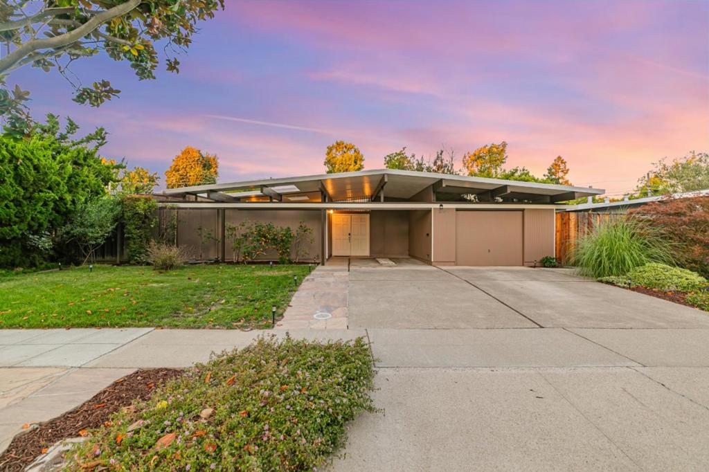 Open Sat & Sun from 1 to 4 pm! Discover this stunning 4-bedroom, 2-bath atrium model Eichler in Sunnyvale's highly desirable Cherry Chase community. Offering approx. 1,960 sq ft of single-level mid-century modern living on a generous 8,064 sq ft lot, this home is filled w/ natural light & Eichler's iconic indoor-outdoor design. Updates include fresh paint inside & out, updated lighting, dual pane windows, & a 2-year-old boiler for radiant heating. The home also features a foam roof & tankless water heater which helps reduce energy costs. The stylish kitchen features Corian counters, large island, a new stainless range, & a spacious walk-in pantry. The inviting living room showcases a classic brick fireplace, perfect for cozy evenings. The primary suite offers a walk-in closet, while a central atrium with powered louver cover creates year-round outdoor entertaining possibilities. The beautifully landscaped yard features persimmon and citrus, raised garden bed, & room to expand or add an ADU. Ideally located near top-rated Cherry Chase Elementary, Sunnyvale Middle, & Homestead High, as well as parks, shops, dining, major Hwys 85 & 280, and Silicon Valleys tech hubs. A rare opportunity to own a classic Eichler w/ thoughtful updates in one of Sunnyvale's most coveted neighborhoods.