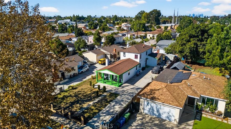 With over 2,600 square feet of flexible interior space, opportunity truly awaits! This duplex was turned into a large single family residence, with the easy potential to be switched back into a duplex or more! 1803 E 109th Place not only offers its own potential rental income, but it also offers an over 7,600+ sq. ft. lot with additional ADU potential, multi-car parking and or RV/ boat parking etc.. The home currently features 5 bedrooms, 2 bathrooms, and 2 additional bonus rooms, offering endless possibilities for a home office, gym, guest suites or even possible expansion into another unit! The original duplex offered two - two bedroom, one bathroom units. One upstairs, and one downstairs. Bring your vision and a plans to make it your own!