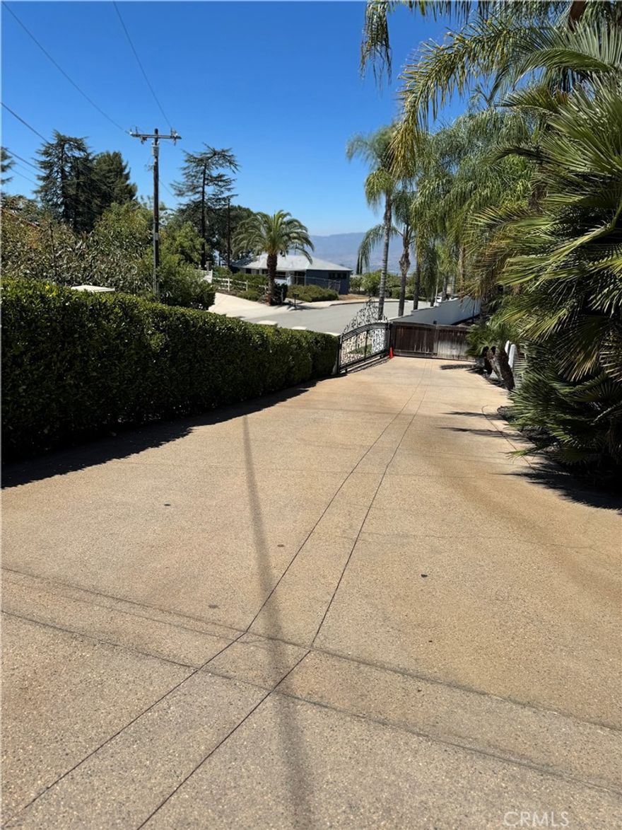PRIVATE GATED 1BR/1BA FURNISHED APARTMENT - SOUTH REDLANDS: Exceptional fully furnished 1-bedroom, 1-bathroom apartment behind secure gates in prestigious South Redlands, featuring separate entrance from adjoining main estate. This turnkey rental includes a spacious bedroom, full bathroom, complete kitchen with stainless steel appliances, comfortable living room, and dedicated dining area - all furniture and utilities included for hassle-free living. Perfect for professional traveling or Loma Linda University students, medical professionals, or anyone seeking convenient all-inclusive living in a quiet, secure gated community with immediate occupancy available.