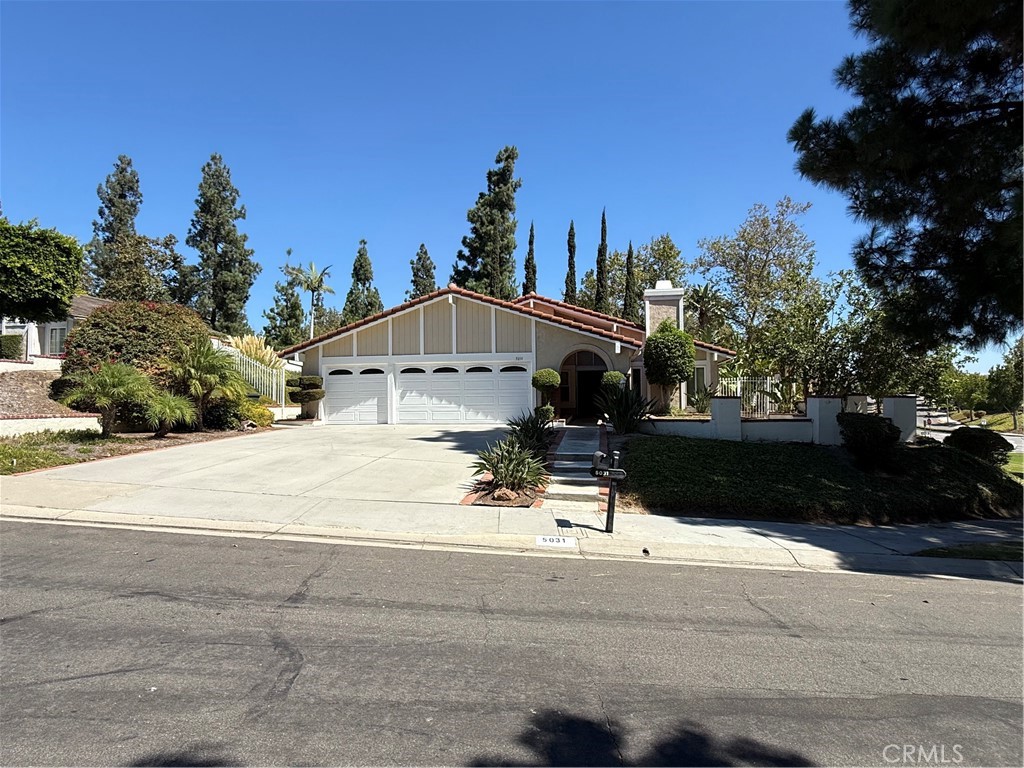 This gorgeous 4 beds 2 baths house with vaulted ceilings and open floor plan is located in the most desirable area of East Lake Village Community in Yorba Linda. East Lake Village Community is very well know for it's well-planned neighborhood with a Lake, Clubhouse, Gym, 3 Pools, Boats you can rent and enjoy and many other recreational amenities. The house is very closely located to the clubhouse and the Park with the fountains. This well-kept property offers plenty of natural light and spacious and airy rooms. Double doors entrance opens up to the formal living area with a cozy fireplace. Combo living room and dining area gives you a great possibility to host lots of friends and family members for holidays! Family room is opening to the kitchen giving an opportunity for the family to cook and socialize with each other after busy working days. The sliding doors from both Family-Room and Master Bedroom takes you out to the backyard where you can enjoy the views of the fountains. Attached 3 car garage, large driveway and 220V outlet plug for EV Charger are also some of the extras of this property. This house has a lot to offer. Come by to see it!