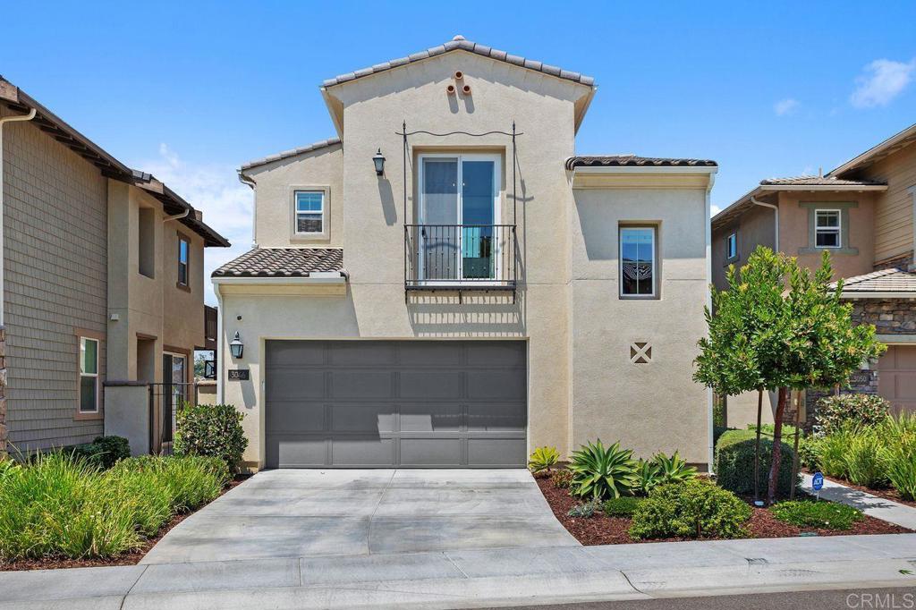 Nestled in the sought-after newish Preserve Community of Carlsbad, just minutes from Carlsbad State Beach and within walking distance to premier shopping and dining, this stunning home offers the perfect blend of modern luxury and natural tranquility. The expansive open-concept floor plan seamlessly combines elegance, warmth, and functionality, featuring light-colored large format tile flooring, a cozy fireplace, dual expansive glass sliding doors that invite natural light to flow through the living space. The chef inspired kitchen serves as the heart of the home, boasting crisp white shaker cabinetry, top tier stainless steel appliances, and a sprawling quartz-topped center island with an oversized sink, pull down faucet, elegant pendant lighting, and custom natural stone backsplash-all creating a true designer look. Backing up to a lush preserve, enjoy the nature while watching the sun go down and the sky light up. This homes outdoor oasis is perfect for entertaining or quiet relaxation. Enjoy evenings around the built-in fire pit, listen to the gentle sounds of the water feature, and savor al fresco dining at the built-in BBQ island, equipped with a sink, all designed to maximize serenity, privacy, and the ultimate coastal style living. Upstairs, you'll find three spacious bedrooms, two full bathrooms, a versatile loft ideal for a home office or playroom, and a convenient laundry room with a deep sink. The primary suite offers dual custom-built-in walk-in closets and a spa-inspired ensuite bath complete with dual vanities, a soaking tub, and a walk-in shower. The Preserve community provides resort-style amenities, including a beach -entry pool with lap lanes, an oversized jacuzzi, a state-of-the-art fitness center, outdoor stacked stone fireplace and BBQ area, playgrounds, a gated dog park, and hiking trails-all served by Top Rated Schools. This home truly embodies coastal living at its finest.