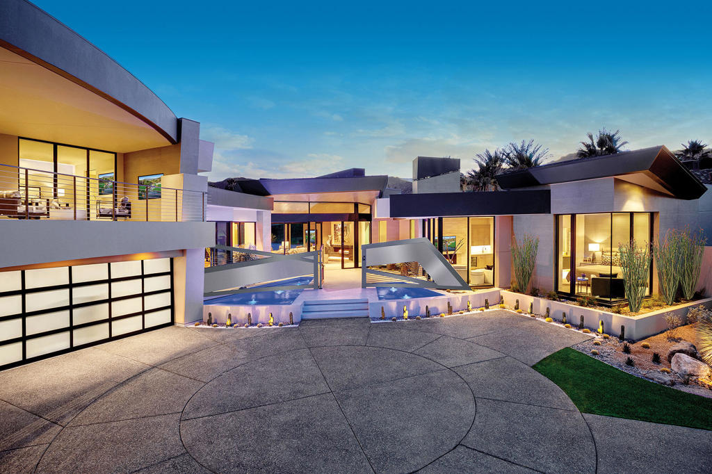 Refined luxury is the ultimate in desert living and exactly what this home has to offer. Newly constructed residence with impeccable detail, featuring state-of-the-art design, open spaces, seamless indoor to outdoor living, multiple entertaining opportunities, unobstructed golf course and mountain views all behind the coveted gates of the most prestigious club in the valley. Stunning architecture with views in every direction. Gated entry courtyard opens to a beautiful water feature. Glass pivot door opens to spacious living with floor to ceiling glass taking in the views beyond. Great room with dining, wet bar, media, and chef's kitchen. The master wing is privately tucked to one side with pocket sliders to outdoor patio, luxurious master bath with expansive his and her closets. A sleek office with floor to ceiling glass overlooking the courtyard water feature. There are two completely separate guest wings; one is a detached casita with a guest living room and 2 bedrooms w/ 2 bathrooms, the other is an interior wing with an additional guest living room, 2 bedrooms/ 2 bathrooms, and an outdoor patio with TV and sitting area. The outdoor living areas offers both entertaining and lounging opportunities with television, fireplace, fire pit, indoor/outdoor access to wet bar, contemporary pool and spa all with a desirable southern exposure. Designer furnishings, home automation, elevator, 4 car plus 2 golf cart garage and solar are a few of the luxuries provided.