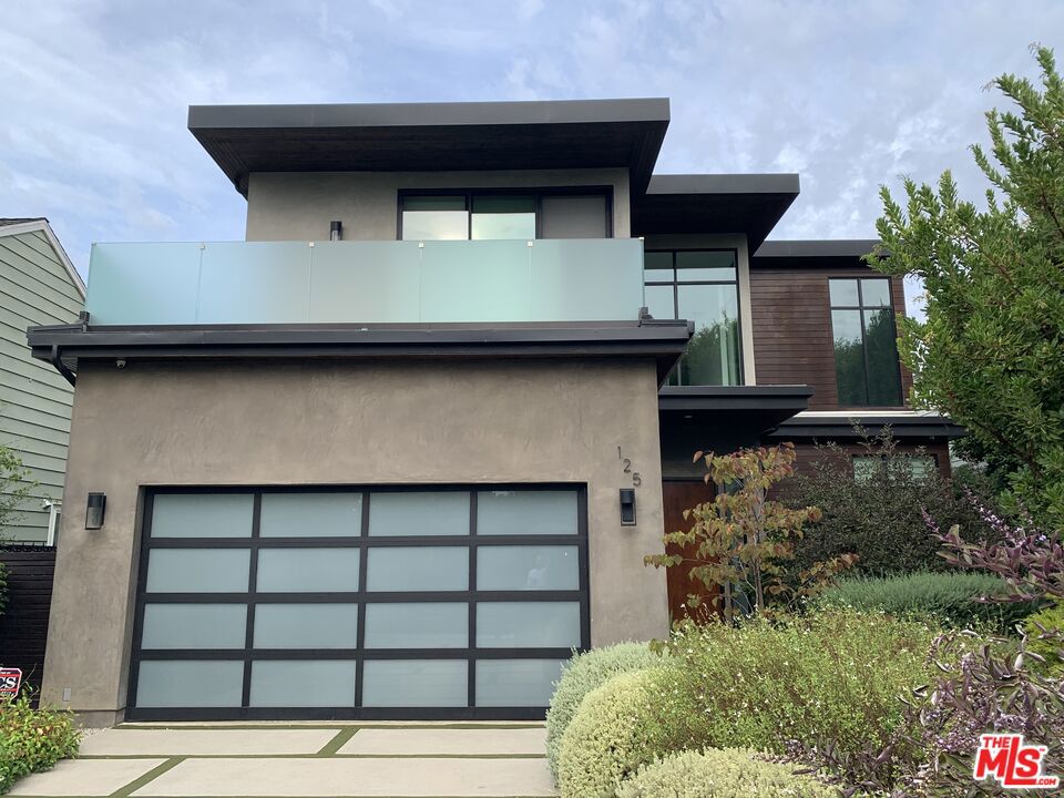 Striking, newer contemporary in one of Brentwood's prime locations. This quality home sits on an 8,000+ flat lot with a private and resort style back yard with a pool, free standing spa, outdoor shower and a built in BBQ station. The home features 4 bedroom suites, plus a separate office and wonderful library or additional family room. The lower level comprises the living room, dining room, dedicated office and great room/kitchen combo with walls of glass that open up to the outdoors. There is also one bedroom suite, a laundry room and 2 car garage with direct access. The upper level comprises an additional 3 bedroom suites and the library or family room with sliding walls of glass to a huge patio overlooking the lush back yard. Incredible kitchen with top of the line Thermador appliances, and a wonderful L-shaped island with a breakfast nook with built in bench seating and a walk-in pantry. The adjoining family room has a fireplace and sliding doors out to the covered patio. The primary bedroom has a fireplace, a large walk-in closet and luxurious bathroom with walk-in shower and free-standing tub. This amazing property boast high ceilings throughout, wood floors, an elevator, owned solar panels with Tesla power storage walls, 2 zone HVAC, built in speakers and an automated pool cover.