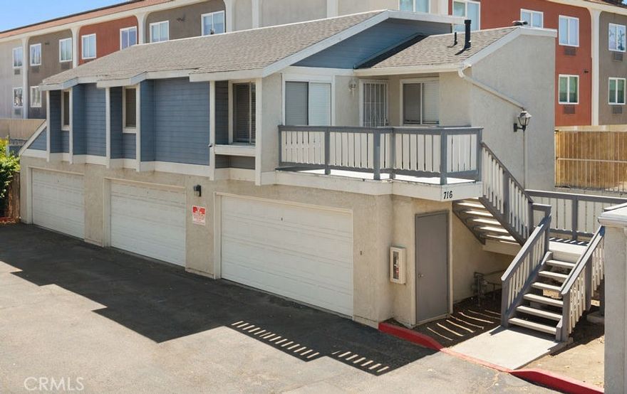 Detached carriage-style condominium with no shared walls, featuring the privacy of a single-family residence. This home features an attached two-car garage directly below the unit. The interior includes an open living and dining area with updated vinyl plank, laminate and tile flooring, a remodeled kitchen with quartz counters and stainless steel appliances, and spacious bedrooms. Additional highlights include a private balcony, updated bathrooms, and in-unit laundry. Located in a small community with easy access to freeways, shopping, and schools. Near Knott's Berry Farm and amusement parks.