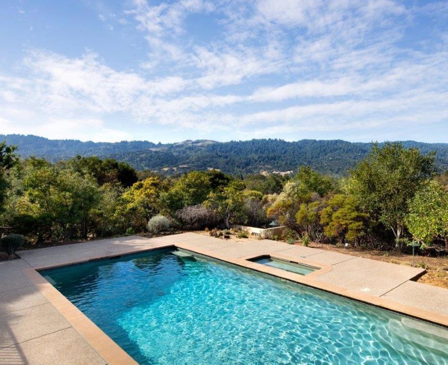 A tranquil, landscaped driveway welcomes you to this privately set 4-bedroom, 3.5-bath residence, distinguished by its breathtaking views of Windy Hill and the coastal range. The light filled floor plan features an expansive living room, formal dining room, sunny kitchen and large family room, all with easy access to the outdoor living spaces.  The master suite, with its vaulted ceiling, stunning view of the western hills and patio access, offers a quiet retreat while a separate wing accommodates a guest room with en-suite bath¬room and an additional 2 bedrooms, bath and laundry room. This quiet cul-de-sac property offers many outside areas for relaxing and entertaining, including a pool, spa and sport court. The central Portola Valley location is convenient to Sand Hill Road, Stanford University, Highway 280 and excellent Portola Valley schools.