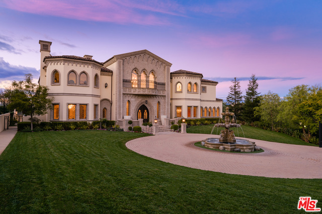 Through the private double guard gates of The Beverly Ridge Estates: a grand custom home that was carefully crafted to express Italian Romanticism while offering all the modern conveniences the heart could desire. Once the gates to the private estate are opened, the magnificent scale of this work of art comes to life. With its perfectly manicured park like grounds, set on a 75,000 ft lot w/ over 15,000 sqftof living space, you enter through the grand room w/ windows that not only flood the home w/ light, but perfectly frame the jet-liner views that await you on one of the largest lots in the community. The home features a custom bar room, family room, home theater room, expansive chef's kitchen, pool/spa & 6 car subterranean garage. Seller will carry.