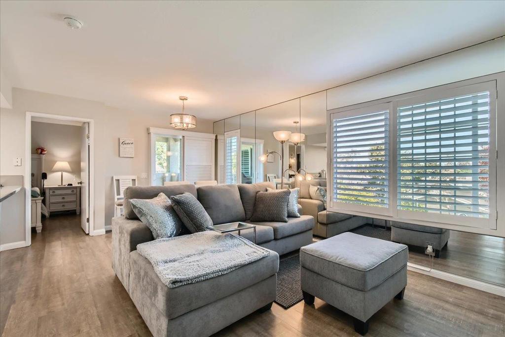 Enjoy privacy, style, and serene surroundings in this fully updated ground-level unit, perfectly positioned away from busy roads. Boasting sweeping views and modern finishes throughout, this two-bedroom, two-bath home is designed for comfort and convenience. The dual primary bedrooms are thoughtfully placed on opposite ends of the unit, offering ideal privacy for guests, roommates, or multi-generational living. Inside, you’ll find a bright and open floor plan highlighted by luxury vinyl plank flooring, fresh designer paint, and dual-pane energy-efficient windows that flood the space with natural light. A sliding glass door leads to the outdoor area and is framed with elegant plantation shutters. The kitchen and bathrooms have been upgraded with quartz countertops, resurfaced cabinetry, and updated lighting, creating a clean, contemporary feel throughout. Located in a beautifully maintained community with access to two resort-style pool areas, a clubhouse, and membership to Lake Mission Viejo for swimming, boating, and summer concerts. This turnkey home offers the perfect blend of tranquility and modern living.
