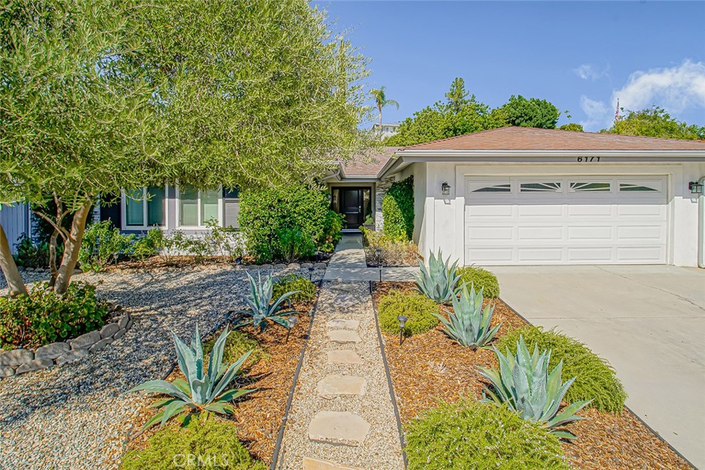 Welcome to 6171 Jared Court, a beautifully updated home in the heart of Woodland Hills. With its striking curb appeal, low-maintenance landscaping, stacked stone accents, and classic black shutters, this residence is sure to impress from the moment you arrive. Step inside to a spacious living room with vaulted ceilings and a cozy fireplace, creating a warm and inviting atmosphere. The sun-drenched kitchen is a chef’s dream, featuring a center island with breakfast bar, a full suite of stainless steel appliances including a 6-burner commercial-grade range and Sub-Zero refrigerator and plenty of space to cook and gather. Adjacent to the kitchen is a generously sized dining area, ideal for entertaining family and friends. Down the hall, you'll find four comfortable bedrooms, including a primary suite with vaulted ceilings, mirrored closet doors, and a private en-suite bath complete with dual sinks and a stylish glass block shower. Fresh paint and updated lighting throughout add a modern, designer touch. The newly landscaped backyard offers a peaceful retreat, complete with a relaxing hot tub perfect for unwinding at the end of the day. Don’t miss the opportunity to make this exceptional home yours!