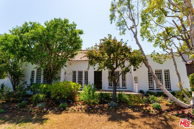 Super charming rare 1-story home in the flats of Beverly Hills. Very large family room with attached kitchen and great top-of-the-line appliances which consist of a 6-burner gas stove, large refrigerator and marble counter tops. Fire place in living room. The garden is beautifully landscaped with a sparkling pool plus private spa next to a guest house which could be used for a gym, office, etc. There are 4 bedrooms and 3 baths. The master has a steam shower and a large walk-in closet. The beautiful wood floors go throughout the house. This is a real charmer - lots of character and warmth throughout.