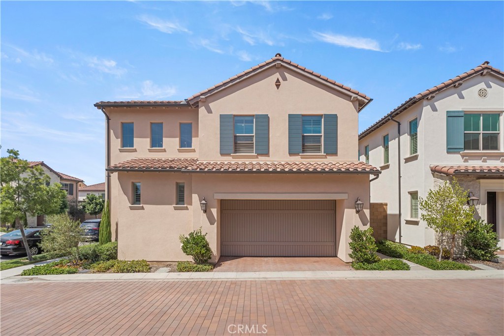 Built in 2022 by Irvine Pacific Homes, this stunning Hillside Plan 3 detached residence showcases modern elegance in the highly sought-after community of Portola Springs. Step inside to soaring ceilings at the entry and an open-concept layout designed for both comfort and entertaining.
The chef’s kitchen highlights a spacious island with seating, quartz countertops, designer tile backsplash, self-closing Shaker cabinetry, and premium stainless-steel appliances. Enjoy seamless indoor/outdoor living through 180° panoramic glass sliding doors that open to a beautifully finished backyard with upgraded tile flooring. The California Room and formal dining area, complete with buffet and bar, are ideal for hosting al fresco gatherings.
Upgraded fabric window treatments and elegant wood shutters add both style and function throughout the home. Retreat to the expansive primary suite featuring a tray ceiling, spa-like bath with dual floating vanities, walk-in shower, soaking tub, and a large walk-in closet, all with tranquil hillside views.
Located just minutes from community pools, clubhouse, parks, tennis courts, basketball courts, and scenic trails. Conveniently close to Woodbury Town Center, Irvine Spectrum, Great Park, and top-rated schools including the newly built Loma Ridge Elementary. Low property tax + Mello-Roos (under 1.3%).
This exceptional home offers modern luxury and resort-style amenities in one of Irvine’s most desirable neighborhoods—don’t miss this rare opportunity!