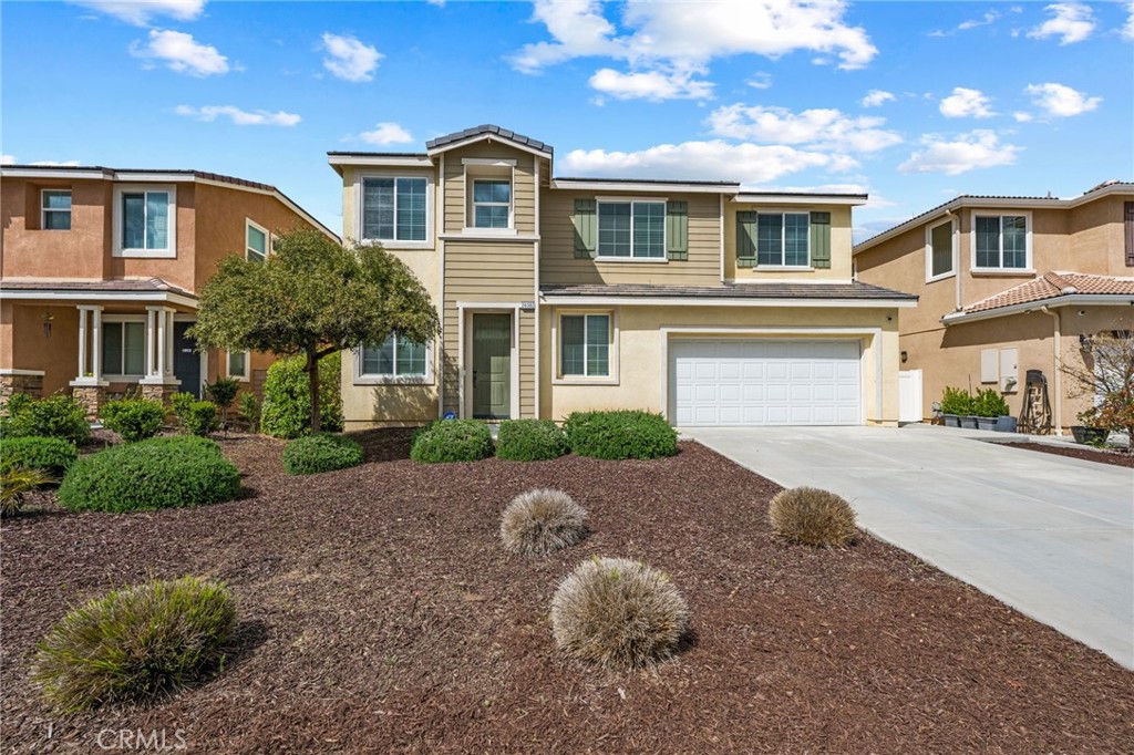 Welcome to 26382 Bramble Wood Cir, a stunning 5-bedroom, 3-bathroom residence located in Menifee’s highly sought-after Pacific Mayfield Community. Built in 2018, this expansive 3,021 sq ft home blends modern design with everyday comfort. The open floor plan connects spacious living and dining areas to a large family room and a chef’s kitchen featuring an oversized island that seats 8, stainless steel appliances, quartz countertops, a walk-in pantry, and a convenient butler’s pantry that connects to the dining room—perfect for entertaining. Downstairs includes a full bedroom and bathroom ideal for guests or multi-generational living, while upstairs offers a versatile loft space and a luxurious primary suite with two walk-in closets, dual sinks, quartz countertops, a soaking tub, and a separate shower. Three additional bedrooms share a beautifully finished bathroom with dual sinks and quartz counters. Additional upgrades include a QuietCool whole-house fan system, ADT security system, a 2-car garage, and a private backyard with durable vinyl fencing. Situated on a 5,663 sq ft lot, this home offers space, style, and a prime location near schools, parks, shopping, and dining. Don’t miss your chance to own this move-in ready home that perfectly balances luxury, comfort, and convenience—schedule your private showing today!