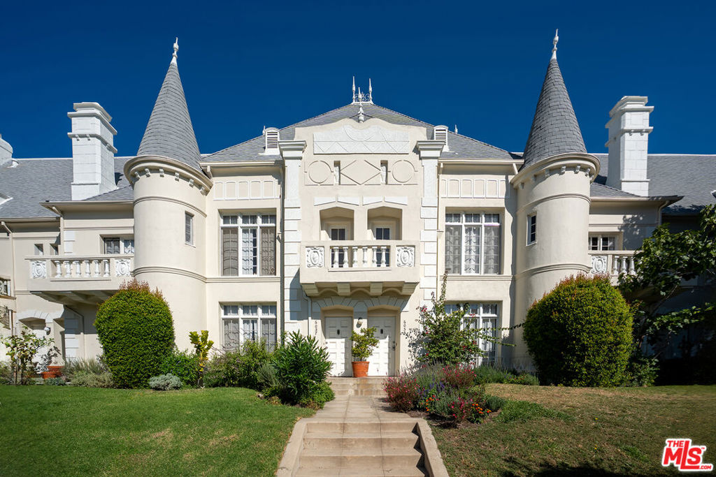 Discover the charm of Chateau Beachwood, a beautiful 2-bedroom, 2-bathroom townhome in Beachwood Canyon with classic French Normandy architecture, available for short-term rental. This historic-style home is rumored to have been built by Warner Bros. to house their female stars, including Marilyn Monroe and Greta Garbo. Madonna and Sean Penn also reportedly resided at this property. The oversized bedrooms and updated bathrooms make for a comfortable stay. Enjoy the private spacious backyard, perfectly suited for entertaining with outdoor furniture, barbecue, and string lights. Inside, the kitchen is equipped with premium Miele appliances. Ideally located near Hollywood recording studios, stunning hiking trails, Franklin Village, The Hollywood Bowl, Greek Theatre, Griffith Park, and more. A unique retreat filled with Hollywood history and modern amenities.