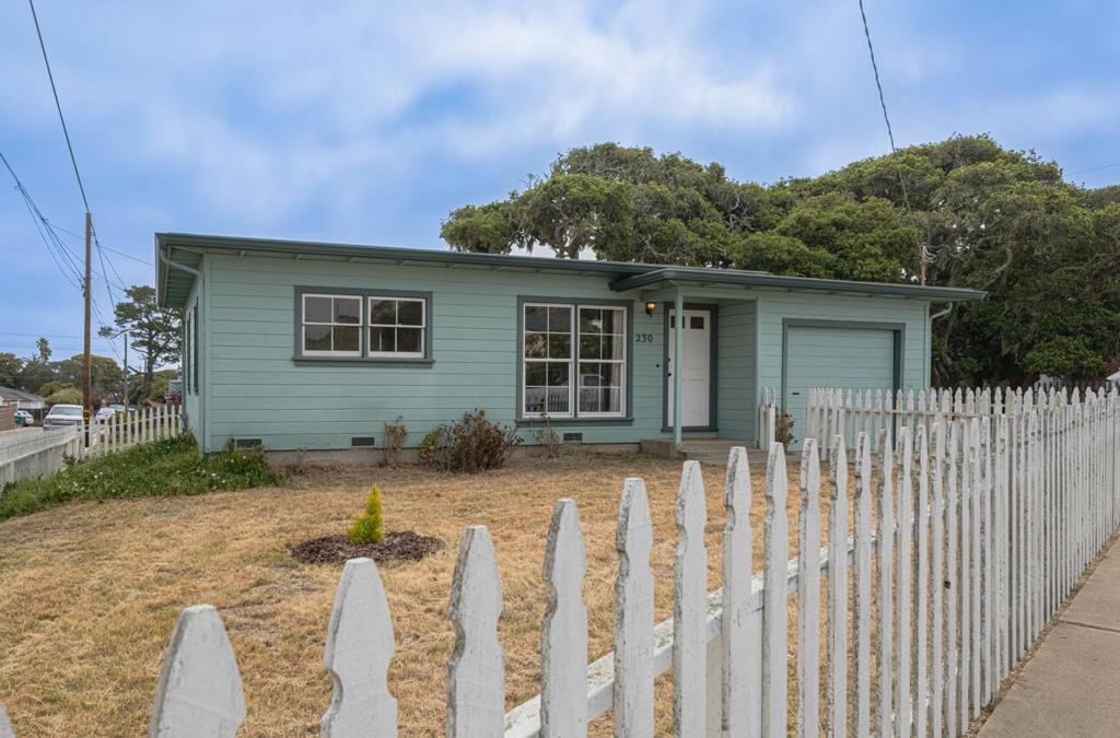Charming Pacific Grove Corner Lot Home! Don't miss this great opportunity to own a delightful 2 bedroom, 1 bath home in a prime Pacific Grove location. Situated on a desirable corner lot, this home boasts hardwood floors and abundant natural light throughout, thanks to its many windows. Just steps away, enjoy ocean views from the corner of David Ave., perfect for peaceful strolls or daily inspiration. The bright kitchen features a gas range and refrigerator, and flows into a cozy dining area with direct access to both the backyard and the attached single-car garage. Both bedrooms are light-filled and offer double sliding closet doors for ample storage. The bathroom includes a tiled floor and a tub-over-shower combination. The garage is equipped with a stacked washer and dryer for added convenience. Enjoy the outdoors in the good-sized yard, complete with mature trees. Robert Down elementary school just 1/2 a mile away! Roof only 7 years old (SF/lot size/school/age not verified by listing agent)
