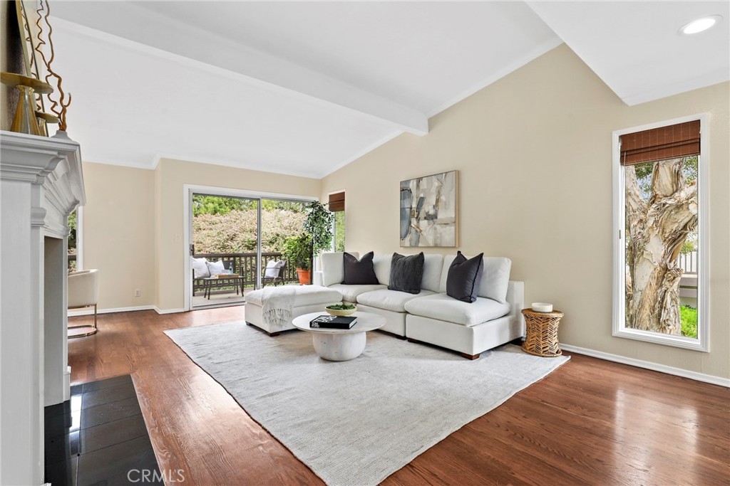Gorgeous, Private End Unit – Largest Floorplan in The Terraces! Welcome to this beautifully updated end-unit townhome, featuring the largest floorplan in The Terraces and exceptional privacy. Nestled against a lush greenbelt with direct access to peaceful walking paths, this home feels like your own private retreat. Enjoy the oversized wraparound deck overlooking a serene, park-like setting – perfect for morning coffee, outdoor dining, or simply relaxing in your sanctuary. Inside, natural light floods the home, highlighting stunning hardwood floors, vaulted ceilings, and a grand fireplace in the spacious living room. The fully remodeled kitchen (2023) boasts white custom cabinetry, quartz countertops, top-of-the-line appliances, and a sunlit breakfast nook. A formal dining area offers the perfect space for hosting family and friends. On the main level, you'll also find a versatile den or office with French doors leading to a quaint balcony. Just down the hall, a bedroom and updated full bath with a walk-in shower offer flexible options for guests or multigenerational living. Downstairs, the expansive primary suite includes two large walk-in closets, a dressing area, sitting space, and an en-suite bath with double sinks. Sliding glass doors open directly to the greenbelt, extending your living space into the tranquil outdoors. A second bedroom on the lower level also features greenbelt access, mirrored closets, and a remodeled bathroom in the hall. Additional highlights include: a roof replacement (2018), full home re-pipe (2016), new garage door and EV charger (2018), two-car garage with built-in shelving and generous storage space, and a dedicated laundry room with built-in cabinets for even more storage. Prime location within the community – quiet and private with ample guest parking just out front. This home blends comfort, elegance, and function in one of the most desirable settings in The Terraces, a gated community with a 24-hour guard, five swimming pools, tennis court, playground, and clubhouse.
Come experience it for yourself!