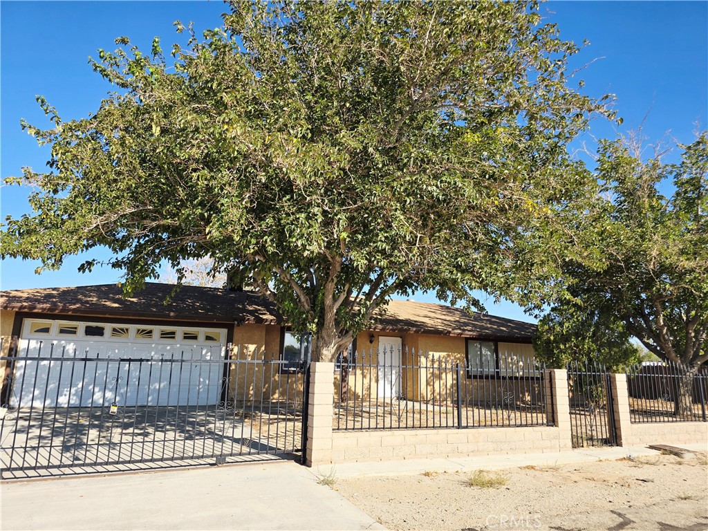 Well-Maintained Ranch Style 3-Bedroom, 2-Bathroom Home with tile floor and nice an modern kitchen in on almost 1 Acre lot. This is very desirable Antelope Valley, very tranquil, private with a big outdoor space, with some trees. 3 generously sized bedrooms and a 2 renovated and spacious bathrooms, this home is ideal for families, hobby farmers, or anyone seeking a peaceful retreat with room to grow. The current owners have lovingly maintained the property, ensuring that it is in excellent condition throughout. The layout includes a formal living room, perfect for hosting guests, a nice and big backyard, making it ideal for indoor-outdoor living. All bedrooms are spacious, offering plenty of room for family members or guests. Outside, the property is fully fenced providing security and privacy. For animal lovers or hobby farmers. With access to both an independent well and the local community water district, the property offers flexible and reliable water options. The well-maintained grounds provide plenty of space for gardening, animals, or outdoor activities. Located in a peaceful area with access to local schools, this home is a rare find—move-in ready
