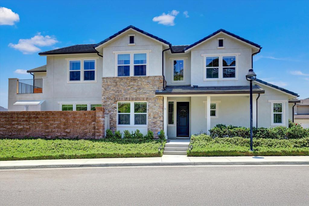 Welcome to your own private oasis in the highly sought-after community of Harmony Grove Village! This beautifully upgraded Contessa Plan 2 home features an open concept design filled with natural light and stunning views of the mountains and surrounding community. The recently updated and spacious living room flows seamlessly into a gourmet kitchen equipped with sleek countertops, a stylish new backsplash, upgraded appliances, and a large island offering both seating and storage. The main floor includes a private bedroom with its own full bath, a dedicated private office, and a convenient half bath ideal for guests or multigenerational living. Upstairs, the luxurious primary suite serves as a peaceful retreat with epic sunrise views from inside and out. Complete with a spa like ensuite bathroom a generous walk-in closet and your own private patio. Two additional bedrooms, laundry room and a large loft provide convenience while offering plenty of flexible space for family or guests. Step outside to more scenic views and relax or entertain guests in your private backyard haven featuring a new outdoor kitchen area and pergola, a California room with a cozy fireplace and built-in television, lush landscaping, a dog run, and ample space for outdoor dining. Additional highlights include a three car attached garage, a prime location on a cul-de-sac, paid solar panels, fire sprinkler system and numerous high end upgrades throughout. Residents of Harmony Grove Village also enjoy access to exceptional community amenities including multiple parks with play areas, a dog park, endless walking trails and a community pool with an outstanding area to entertain.