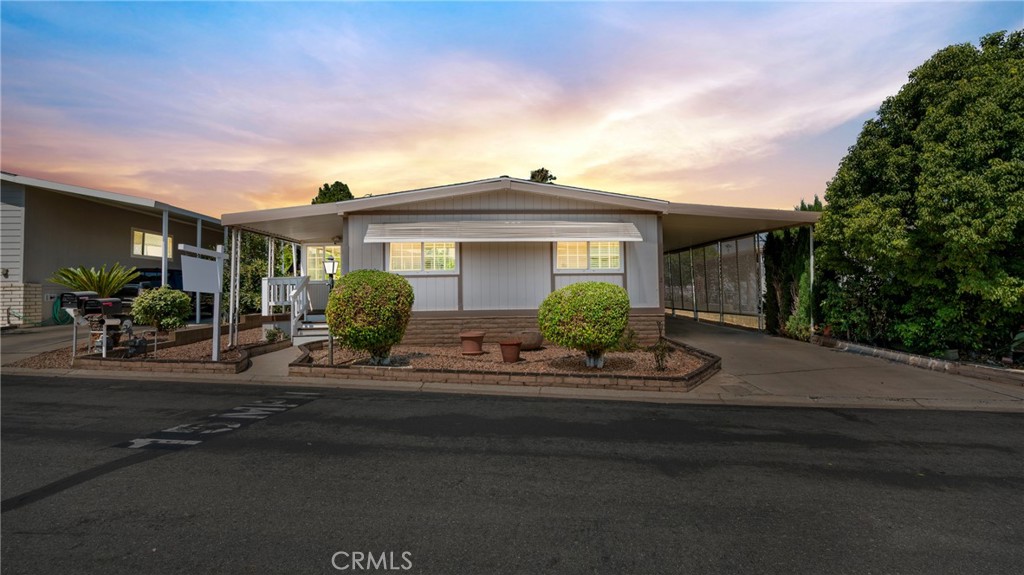 Charming 2-Bedroom Home with Land Ownership in 55+ Community
Welcome to your beautifully upgraded mobile home where you own the land—no space rent! This well-maintained 2-bedroom, 2-bathroom home is located in a 55+ community and features two spacious primary suites, each with its own private bathroom—perfect for guests or shared living.
Step inside to find stylish touches throughout, including crown molding, wainscoting, and durable vinyl flooring that adds elegance and easy maintenance. The open living and dining areas flow seamlessly, creating a warm and inviting atmosphere.
Enjoy the convenience of an attached carport, plus a large storage shed for all your extras. Relax and unwind in the community’s heated pool and spa, all part of the affordable HOA amenities.
Don’t miss this rare opportunity to own a beautifully finished home with land included in a welcoming and well-kept community.