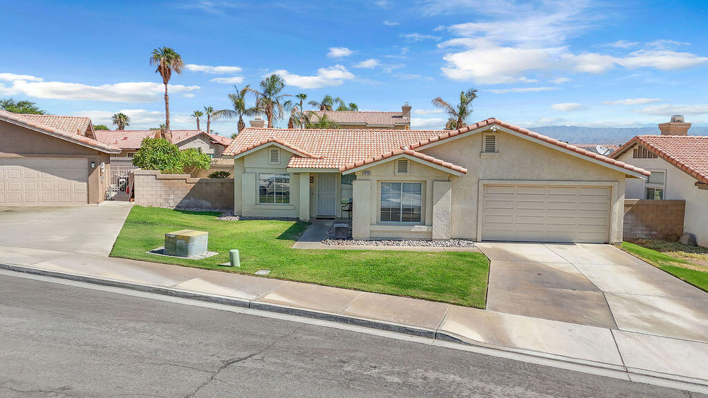This bright and welcoming 4-bedroom home is nestled on a quiet cul-de-sac in the desirable La Quinta Del Rey community. Step inside to find a spacious floorplan with fresh interior paint, new carpet, updated lighting, and a cozy fireplace at the heart of the living space. The kitchen and bathrooms feature sleek granite slab countertops, offering a modern and polished touch. Outside, enjoy a newly updated pool, Cool Deck surface, and an insulated patio cover--perfect for relaxing or entertaining. The backyard is beautifully accented with plumeria trees and easy-care landscaping. Additional highlights include a finished garage with epoxy flooring, an insulated door, and upgraded opener. A stylish and low-maintenance rental home ready for your enjoyment! Available as a seasonal rental