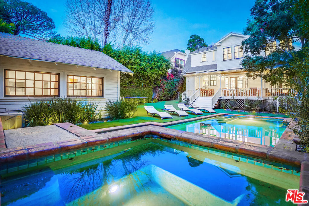 Fully renovated Dutch Revival home just steps from Runyon Canyon! Nestled in the highly coveted Sunset Square neighborhood, with stunning views of the Hollywood Hills, this residence seamlessly blends California Craftsman charm with modern elegance. Every detail of the home has been upgraded to meet contemporary standards, new features include: new roof, copper plumbing, newly wired electrical, and modern HVAC systems. As you step inside, you'll be greeted by pristine hardwood floors, custom built-ins, and historic millwork that honor the home's original aesthetic, while modern designer fixtures add a touch of sophistication. Soaring ceilings and custom skylights flood the interiors with natural light creating a serene and airy ambience. The spacious floor plan includes a formal living room, elegant dining room, and a fully stocked Chef's kitchen with Marble counters and commercial grade appliances (Including a Viking Stove/Oven). All of these rooms flow seamlessly into the oversized back porch to create the perfect environment for indoor/outdoor dining and entertainment. The beautifully landscaped backyard features mature trees and low-maintenance artificial grass which surround a sparkling pool and spa - your private oasis for sunny days and tranquil evenings. Last but not least is the detached guest house; offering versatility as a private home office, epic game room, or a comfortable retreat for visitors. This is a rare opportunity to live in one of LA's most desirable areas, where nature and city life meet! 6 month to 1 year lease preferred. Embrace the luxury and charm of this exceptional home - don't miss out!