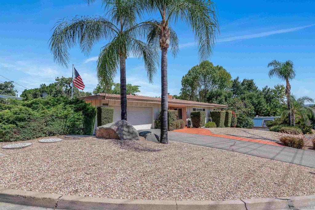 Classic Ranch style home that has been lovingly maintained by the same owner since 1966. Many improvements and upgrades over the years including dual pane windows, new heating unit, kitchen countertops and ceiling fans. A quick ride to shopping, dining, freeways, schools, Kit Carson Park and the Wild Animal Park! The lot is over 1/3 of an acre which has a gated RV parking area with hookups. The backyard is an oasis that has a deck, low maintenance landscaping and several avocado trees. The expansive yard and deck area are perfect for entertaining and room to play. One bedroom and a bathroom are located at the opposite end of the other 2 bedrooms and bathroom which is ideal for extended family or guests. The central area of the home has a formal dining room, living room, family room with a fireplace and a "leisure room" which opens to the backyard. Plenty of spaces to play, entertain or just relax. This home was designed for entertaining and enjoying family and friends. Original building plans come with the house. A few cosmetic improvements will make this your new home! Escondido means "hidden valley" and you will see why the original owners lived here for so long! See Supplement for details... This mid-century home has the following features: * Central heat and AC with newer heating unit. * Large corner lot with a backyard oasis perfect for entertaining and playtime. * Tiled front porch that leads to a formal entry into this generous 2248 ESF home. * Leaded and stained glass windows. * Formal living room with plantation shutters and dual pane windows that flood this room with sunlight. * Most every window and sliding glass door has been replaced with Milgard Windows. * Formal dining room with south facing window adjacent to the kitchen. * The family room opens to the kitchen and has a fireplace with raised marble hearth and slump block the fireplace has a gas lighter. Ceiling fan, solar tube, privacy plantation shutter doors that lead to the "leisure room" all make this a fun and wonderful space to relax and entertain. * The kitchen opens to the family room and has an 11' counter bar perfect for entertaining. Newer fabricated countertops, stainless steel double sink, newer side-by-side Samsung refrigerator, gas cooktop and double oven. The kitchen has a window that overlooks the backyard and recessed lights illuminate your workspace. * All bedrooms have windows and ceiling fans and ample closet space. One bathroom and bedroom are located at the opposite end of the house which is perfect for guests or extended family. This is a real plus! * Guest bathroom has a newer shower stall and a large sink counter with lots of cabinet space. This bathroom also has a privacy window. Plus that classic pocket door! * Primary bedroom has tons of closet space and a built-in dresser. The window has views to the backyard and treetops. Maybe add a deck off of this bedroom one day. * The "Leisure Room" opens to the backyard and has 2 separate sliding glass doors that combines the outdoors with the indoors. * The outdoor oasis includes a wood deck (16x15) shaded by a producing avocado tree, fenced for keeping the pets safe and a barbecue that is hooked up to a gas line. This corner lot is 1/3rd acre of mostly low maintenance landscape. At the very lower corner of the property is a gated RV parking spot with hookups. Great space for play and entertaining. * The oversized garage (23x24) has a laundry sink and some cabinetry. Attic access for extra storage. The washer and dryer remain with the home. Truly a gem of a home in the great city of Escondido at an exceptional price!