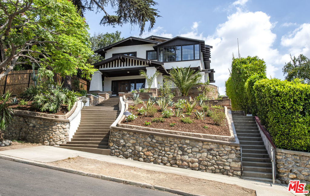 Welcome to one of Silver Lake's most enchanting treasures, a lovingly preserved 100-year-old Craftsman with views from the ocean to Downtown La that perfectly blends historic charm with modern-day luxury. Nestled on a classic Eastside street just steps from the area's hottest cafes, boutiques, and eateries, this home embodies the creative energy and style the Eastside is known for. Inside, original details, warm woodwork, character built-ins, and soulful craftsmanship, transport you to a bygone era, while the reimagined kitchen and bathrooms bring today's comfort and functionality front and center. With 5 bedrooms and 3 bathrooms, this home offers space to spread out, create, and dream. Step outside to your epic private yard, a rare find in the heart of Silver Lake, perfect for alfresco dinners, weekend gatherings, or simply unwinding under the California sun.This is more than just a home, it's a piece of Los Angeles history, refreshed and ready for its next chapter as one of the finest vintage homes Los Angeles has to offer.