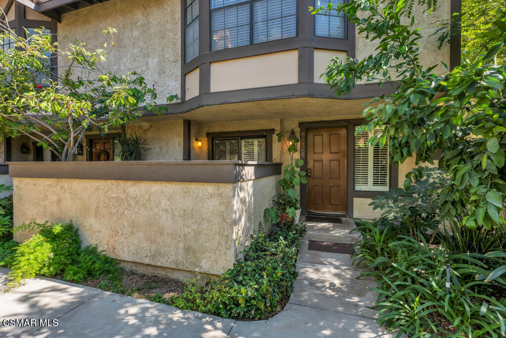 Modern style meets everyday comfort in this beautifully updated 3-bedroom, 2.5-bathroom townhome in the heart of Winnetka. Enter inside to find light-filled living spaces with wood-like flooring, recessed lighting, plantation shutters, and contemporary fixtures throughout. The kitchen is a true highlight with sleek quartz countertops, stainless steel appliances, and a clean, modern design. Upstairs, the primary suite impresses with vaulted ceilings and abundant natural light, while the guest bathroom features a stylish vanity and flooring. Enjoy both a spacious private backyard with an awning--perfect for summer entertaining--and an additional front patio for extra outdoor space. The home also offers a large two-car garage, and the community itself is beautifully landscaped with park-like grounds, plus a pool and spa for year-round enjoyment.