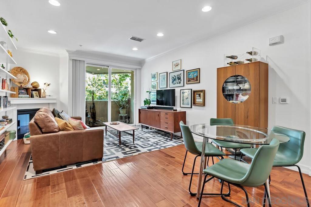 Welcome to one of the largest one-bedroom floor plans available in East Village. This home features a generously-sized bedroom with walk-in closet, spacious hallway with laundry, storage, and curved accent wall, and large bathroom with upgraded shower. The highly functional kitchen with stainless steel appliances was upgraded with new cabinets and countertops in 2021. Other upgrades include fresh bedroom carpet and fresh paint (2021), customized closet system, and designer lighting fixtures. Includes 1 parking space in secured garage and dedicated storage locker (4'x6'). See supplement... Master bedroom has plenty of room for a king-size bed. Access controlled building. Located across the street from Michelin Bib Gourmand recognized Callie restaurant. Other nearby restaurants include Hinar Cafe, Storyhouse Spirits, and Modbom. Mere blocks from Petco Park and all that the Gaslamp Quarter has to offer. Ideally located steps from the Park & Market Trolley Station (blue line to UCSD & UTC).