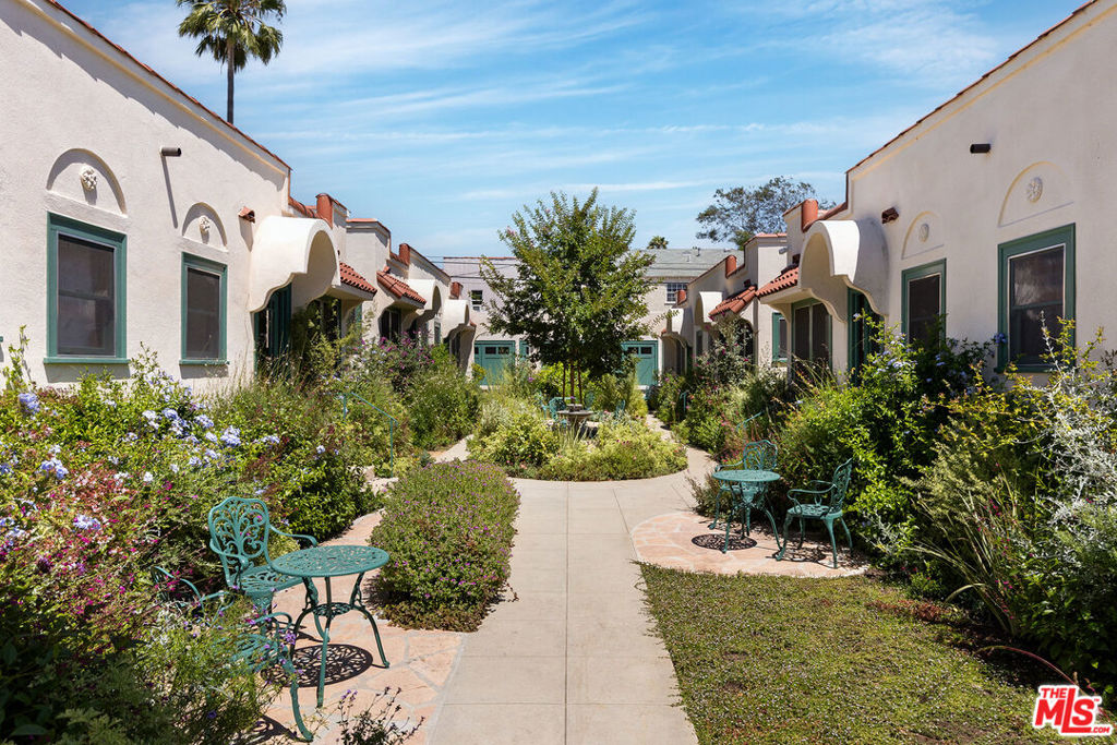 A rare opportunity to acquire a luxurious, restored 1923 Spanish Revival courtyard complex in the heart of the city perfect for a multi-generational or extended family compound, a buyer seeking guest residences for visiting friends or relatives, a collector of legacy architecture, or even a foundation or institution looking to house visiting fellows, artists, or scholars. The property also offers compelling potential for investors, with high-end finishes, vacant delivery, and flexible use options that make it attractive as both a residence and an income-producing asset. The historic Edinburgh Bungalow Court is a designated Los Angeles Historic-Cultural Monument and recipient of the Los Angeles Conservancy's 2023 Preservation Award. The property consists of four structure seach with two side-by-side 1BD/1BA residences (approximately 532 sq ft each)arranged around a serene, gated courtyard. Every unit has been luxuriously and thoughtfully restored to showcase period authenticity with modern conveniences: handmade wood windows and doors with wavy glass, lathe-and-plaster walls, light sand-finished ceilings, Claycraft tile, and vintage vertical-grain Douglas fir cabinetry. White oak hardwood flooring runs throughout the living areas, while bathrooms feature classic clawfoot tubs and octagonal tile floors. Kitchens are outfitted with Sub-Zero refrigerators, built-in wood-paneled dishwashers, and vintage, fully restored O'Keefe & Merritt double ovens. Each unit includes its own private laundry room with washer/dryer. The renovation extends well beyond aesthetics, incorporating major system upgrades and infrastructure improvements throughout. Each unit has its own electrical meter, and all eight benefit from brand-new central air and heating systems. Six garages (with 220V plug for EV charger), two surface parking spaces, and a bonus studio unit near the garages ideal as a shared community room, office, or creative space complete the offering. All units are currently vacant and ready to be leased or occupied immediately. Located just north of Melrose and west of Fairfax, the property sits in a walkable, design-forward enclave where offerings of this caliber are exceedingly rare. A unique chance to own a fully restored historic property that combines architectural integrity with modern luxury suitable for personal use, income, or long-term legacy.