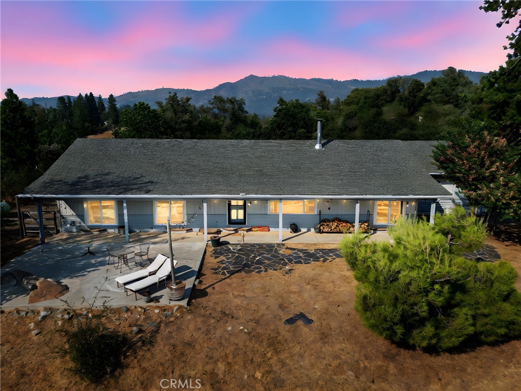 Your Private Retreat Awaits
Calling all entertainers and homebody heroes, have we found your perfect match! Dreaming of an escape where the road ends and your private story begins? Your search is over. Welcome to your sanctuary, a custom-built 1,647 sq. ft. home offering end-of-the-road privacy in the desirable Tip Top Road area. Situated on 5.6 usable acres, this is where you'll find the peace of dark night skies and the freedom to roam, all set against a backdrop of breathtaking sunset views over a twinkling sea of city lights.
This nicely appointed 4-bedroom, 2-bathroom residence offers a flexible layout perfect for a growing family, guests, or a dedicated home office. Peace of mind is built-in; a whole-house propane generator ensures you're never without power. Countless updates include new double-pane windows and sliders, new appliances, an efficient wood stove for cozy evenings, central air and heat, and beautifully remodeled bathrooms. The interior is fresh, clean, and truly move-in ready, so you can start enjoying your new life immediately.
The true luxury, however, is the land. All 5.6 acres sit on an official CAL FIRE-maintained fuel break, offering incredible security and a park-like setting for hiking and exploring. The property features a fenced garden with a variety of fruit trees and vegetables, as well as a small barn that’s perfect for animals or can be converted into a workshop. Imagine picking fruit from your own trees and tending your garden. This isn't just a home; it's a lifestyle.
This property has been prepared for its next chapter and awaits your personal touch. The exterior is a blank canvas, ready for you to choose the perfect color that completes your vision and makes this incredible rural retreat uniquely yours. A property that combines this level of privacy, views, and modern readiness is a rare find. Schedule your private tour today and start living the life you've only imagined.