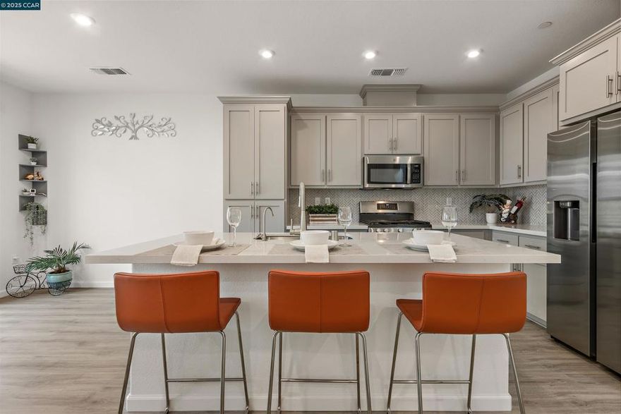 Located in the highly desirable San Marco community of Pittsburg, this stylish, energy-efficient duet built in 2021 offers 3 bedrooms, 2.5 bathrooms, and an attached 2-car garage. Step inside to find an open-concept layout with high ceilings, abundant natural light, and contemporary finishes throughout. The gourmet kitchen features quartz countertops, stainless steel appliances, ample cabinetry, and a spacious island—ideal for cooking and entertaining. The bright living and dining areas flow seamlessly to a cozy private patio. Upstairs, the spacious primary suite includes a spacious walk-in closet and an en-suite bathroom with dual vanities. Energy-efficient features include owned solar panels, a tankless water heater, and dual-pane windows, helping you save on utility bills year-round. HOA amenities include basketball, bocce and picnic area. Just a 1–2 minute drive to Starbucks, Sprouts Grocery, Cold Stone Creamery, and more. Minutes from Pittsburg Center BART, this home offers an easy 15-minute ride to Concord, about 35 minutes to Oakland, and under an hour to downtown San Francisco—ideal for professionals working at Kaiser, John Muir Health, PG&E, or in the Financial District. A dream location for East Bay and city commuters alike.