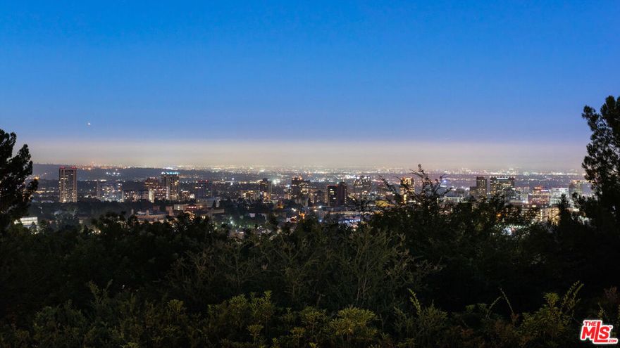 Tucked behind gates within the comfort of Bel-Air among flourishing greenery, this hidden gem is the perfect opportunity for investors and developers to build or remodel an existing estate in a paramount location! Picturesque views await from every vantage point on this promontory displaying the lush environment by day and mesmerizing skyline by night. While conveniently located a stone's throw from the UCLA campus, the Bel-Air Country Club, and just minutes from Sunset Boulevard the property remains rich in privacy and tranquility.