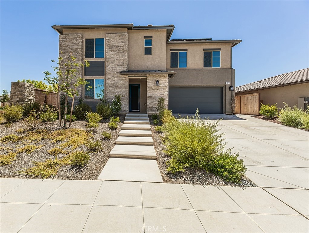When you enter this home, you will feel true pride of ownership. This outstanding like new, beautifully maintained McCaffrey 4 bedrooms, 3.5 baths home has over $90,000 in upgrades and options. The floorplan is the very desirable Sage model with the downstairs Jr. Owner Suite which gives you the option for two primary bedrooms and bathrooms to meet all of your family's needs and living space. This area has many upgrades including a large walk in closet, and luxury bathroom with lots of light and double sinks. The open floorplan with a very large great room opens to the kitchen and dining room areas that make it ideal for entertaining. The gourmet kitchen with a very large eating bar with lovely quartz countertops includes top of the line appliances with a gas 6 burners cooktop, microwave /convection/double oven, farm sink and an amazing walk in pantry. Enjoy the delightful builtin wine bar and refrigerator. Upstairs is a beautiful, very spacious additional primary bedroom with a large walk in closet and designer tiled super deluxe upgraded shower with double sinks for all your comfort and needs. The two bedrooms and loft area by the landing are conveniently located for every member of the family. The laundry room is nearby with extra cabinetry and laundry sink. The 3 car garage with extra insulation is fully finished and has been used for the family's in-home gym all of which can be removed prior to close of escrow unless buyers are interested in some of the cabinetry, flooring, etc separate from the sale. The immaculate rear yard with a concrete side wall has been completed to add to an easy care lifestyle and for many hours of relaxation and enjoyment. These sellers love this home and are downsizing since there has been a change in their family size. You will be delighted to tour this home and see all the extras this home has to offer.