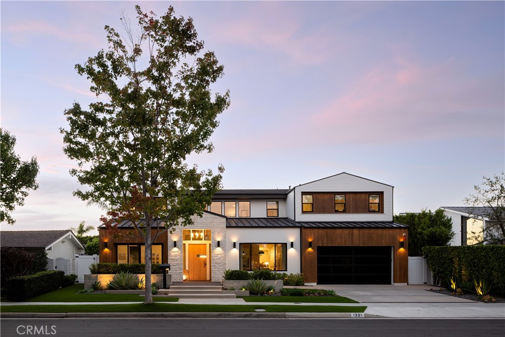 Tucked away on a quiet, desirable street in Dover Shores, 1331 Antigua Way embodies modern coastal luxury at its finest. Built in 2022 and designed by Morrison Interiors, this architectural masterpiece spans approximately 4,800 square feet, offering 6 bedrooms and 6.5 bathrooms of refined living. Light fills the open floor plan, where soaring ceilings and clean lines flow effortlessly into an expansive California room that defines true indoor-outdoor living. Here, days unfold around the pool and spa, with spaces designed for gathering, relaxing, and entertaining under the Newport Beach sun. At the heart of the home, the chef’s kitchen stuns with dual Calacatta porcelain waterfall islands, custom cabinetry, and designer lighting, crafted for both beauty and function. Every detail reflects thoughtful design, from the bonus casita to the Control4 smart system, solar power, soft water tanks, and EV charging port in the three-car tandem garage. 1331 Antigua Way isn’t just a home, it’s a modern sanctuary designed to elevate everyday living in one of Newport Beach’s most coveted communities.