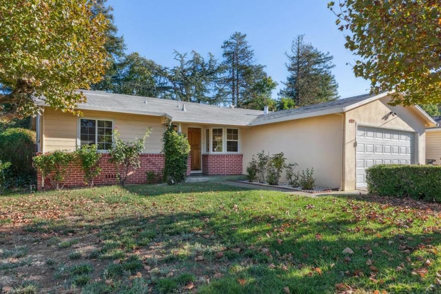 Situated on a corner lot with thoughtful updates and a prime location. Front lawn enhanced by automatic sprinklers, mature shade trees, and a brick façade. Step through the formal entry into a light-filled interior featuring hardwood flooring, dual pane windows, and central forced air heating and cooling throughout. The spacious living room centers around a cozy tile-surround wood-burning fireplace, with a screened-in patio just off the living area, perfect for additional entertaining or relaxation space. The kitchen boasts a delightful breakfast nook and the adjacent dining area is bathed in natural light, creating an ideal setting for meals and gatherings. The primary bedroom suite includes a private ensuite bathroom with a stall shower and tile flooring. Two additional bedrooms offer mirrored double-door closets and share a full bath complete with a vanity, tile floors, and a shower over tub. Enjoy outdoor living in the tranquil, low-maintenance backyard, featuring a sprawling paver patio, and a lower-level covered patio with a storage shed. A two-car attached garage provides abundant storage and convenience. Prime location near top amenities: Just minutes from Concord Community Park, BART station, and major highways. Close to schools, shopping centers, restaurants, and more!