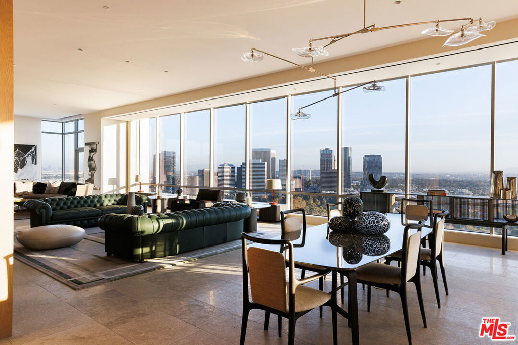 Presenting a newly completed, never-before-seen, new-to-market luxury penthouse at the ultra-exclusive Beverly West residential high-rise, positioned at the edge of the Los Angeles Country Club and offering sweeping unobstructed views of the hills, ocean, mountains, and city. From this fresh address in the sky, marvel at every iconic landmark that has made LA a global metropolis and worldwide destination. Spanning the entire twenty-second floor with a 360-degree field of vision, the impressive space was expertly conceived by critically acclaimed interior designer Lisa Garriss of Plum Design West, resulting in a final product unlike any other the region over. Encased by exceptionally high floor-to-ceiling walls of glass, this sprawling 7,976-square-foot residence promises an existence at the pinnacle of sophistication and refinement. Bar, dining, and great room are laid out with entertaining top of mind, separated from the chef's kitchen to segregate party guests from the diligent culinary masters curating fine cuisine within. The east- and south-facing primary suite has an exquisite resort-inspired bathroom with dry sauna, balcony, massive wardrobe, and studio which can serve as an office, library, media room, or anything imaginable. A nearby junior primary and other bedrooms all benefit from this viewpoint in the sky, each light-filled and appointed with the choicest materials and finishes. This exclusive high rise provides numerous amenities such as direct-to-unit passenger and service elevators, pool and spa with outdoor-theatre-style projector, boardroom, large Technogym, house car, concierge, valet, and 24-hour security. Strategically sited, Beverly West is LA's best-kept secret. Experience a uniquely uber-luxe lifestyle at this rare, unmissable discovery! Video is of similar penthouse.