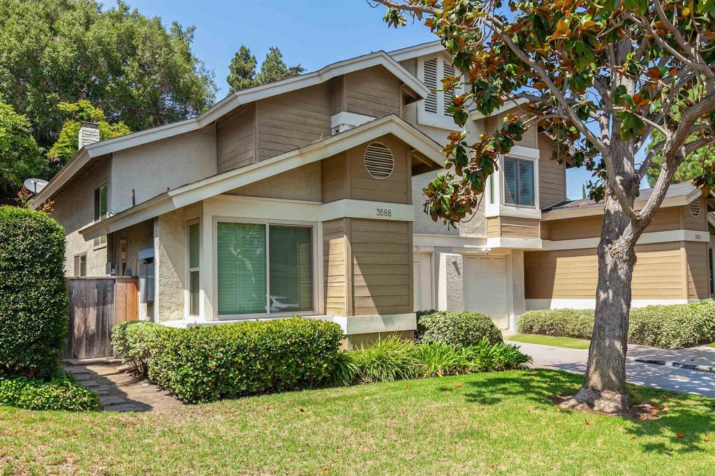 Stylish Townhome Retreat in a Peaceful San Diego Community. Welcome to 3688 Cactusview Dr., a beautifully updated townhome offering the perfect balance of comfort, style, and convenience. Nestled in a tranquil neighborhood surrounded by mature trees and lush landscaping. This residence provides a serene retreat while still being close to all that San Diego has to offer. Step inside to discover an inviting open floor plan with soaring ceilings and abundant natural light. The spacious living area flows seamlessly into the dining and kitchen spaces, making it ideal for both everyday living and entertaining. The remodeled kitchen is a chef’s delight, featuring rich wood cabinetry, modern tile backsplash, sleek quartz countertops, a large center island with seating, and stainless steel appliances. Upstairs, you’ll find generously sized bedrooms, including a private primary suite complete with ample closet space and an updated en-suite bathroom. Additional features include wood-look flooring, recessed lighting, stylish pendant fixtures, and large windows that frame peaceful views of the surrounding greenery. Enjoy outdoor living with a private patio and the attached garage provides convenience and extra storage. Centrally located, this home offers quick access to shopping, dining, parks, freeways, and all the amenities of vibrant San Diego living.