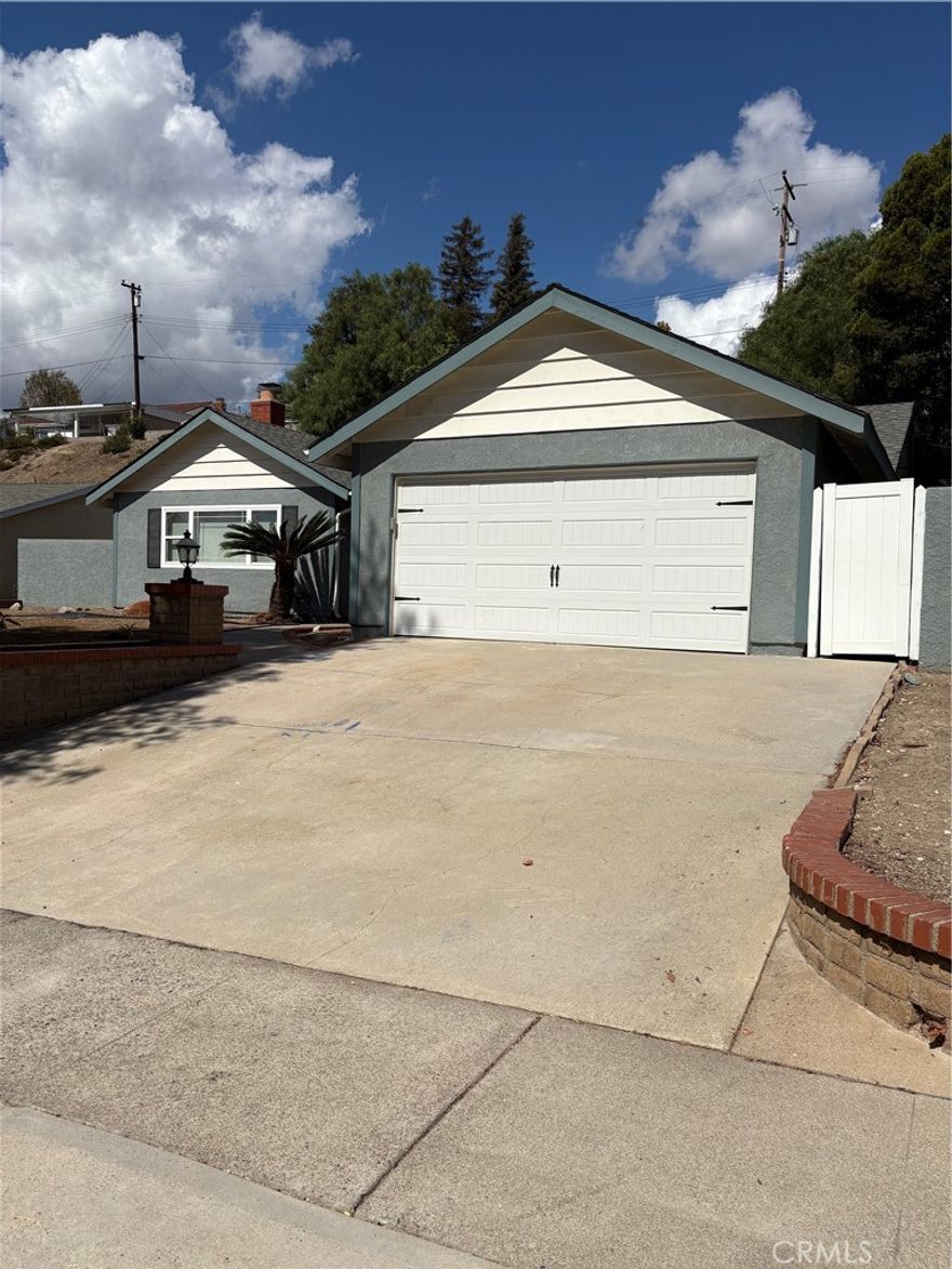 Beautiful Single-Story Brea home on a spacious 10,579 sq. ft. lot! This home features new SPC flooring throughout, fresh interior paint, and upgraded insulation for comfort and energy efficiency. Enjoy dual pane windows, and a bright, open layout. The remodeled bathrooms include modern finishes, with a convenient Jack & Jill sink in hallway bathroom.

The kitchen is upgraded with granite countertops, glass backsplash, stainless-steel appliances (including a new dishwasher), and overlooks the large living room with a cozy fireplace, recessed lighting, and ceiling fans. Through the French doors in the dining room, step into the expansive backyard with artificial turf and a covered patio—perfect for entertaining.

The 2-car garage offers extra storage with cabinetry and 2 workbenches. Laundry is a breeze with a new washer and dryer included.

Located in the award-winning Brea Olinda School District, close to Mariposa Elementary, Brea Jr High School, and Brea-Olinda High School