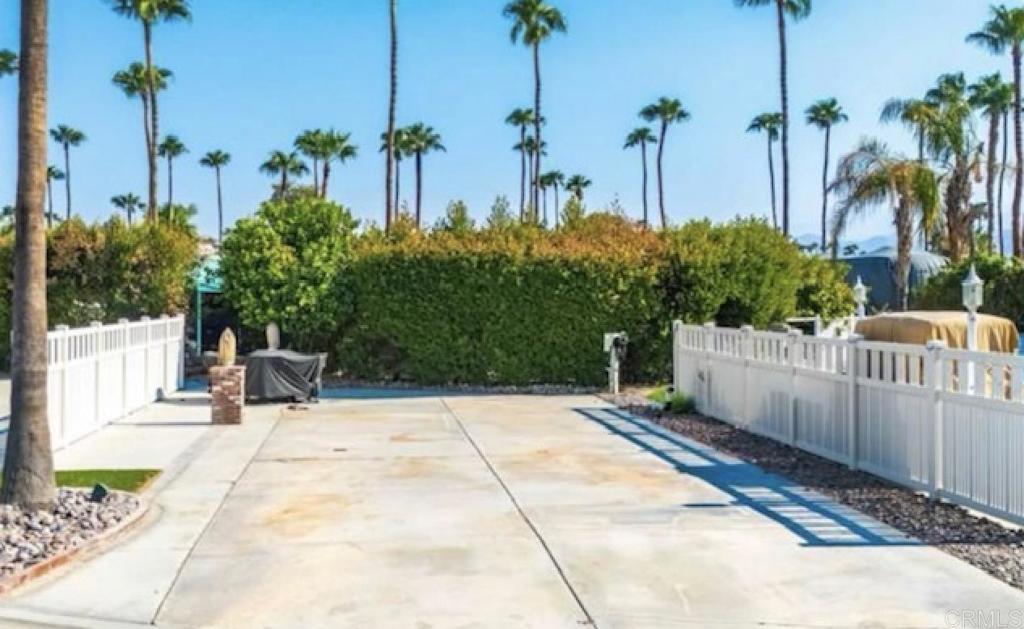 Lot 41, Convenient to the neighborhood tennis court, pool, jacuzzi, laundry and perfectly maintained bathrooms, this south to north oriented space with nice concrete offers wonderful morning sun and afternoon shade. Surrounded by lush green hedging it’s convenient to the resort entrance, large LaPalma clubhouse and restaurant. Outdoor Resort Palm Springs (ORPS) is a Guard Gated 5-Star RV Resort Community offering an active and luxurious lifestyle featuring golf (27 holes), tennis, pickleball, swimming and more! Two clubhouses, fitness center, beauty solan, La Roma Restaurant on campus, dog park and more!