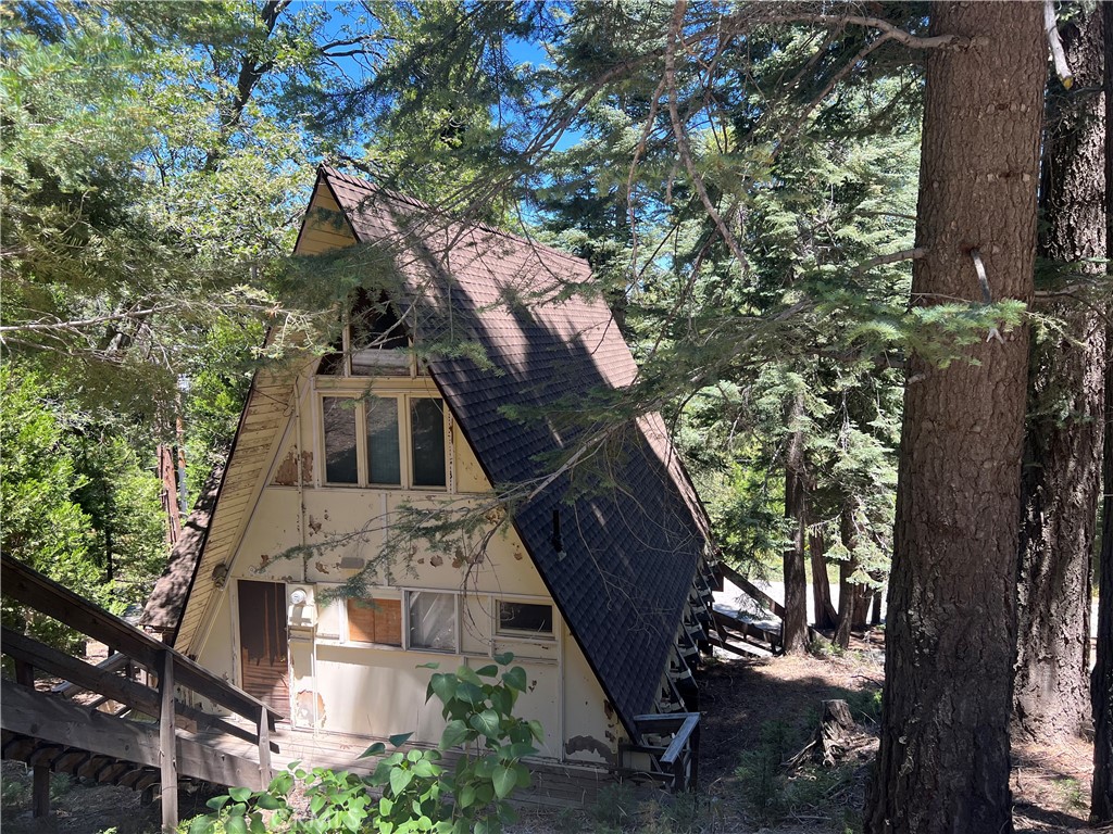 Attention A-frame lovers! Now is your chance to roll up your sleeves, and customize your dream house. This mountain classic is just waiting to be restored to its former glory, and to become the showplace that you’ve always dreamed of. This home is very roomy, with three bedrooms, a game room, large living area, and retro kitchen. Leave it classic and timeless, or bring it into the 21st Century! Your choices are only limited by your vision.