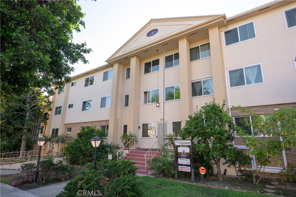 Welcome to this charming single-story 2BD/2BA condo in a highly sought-after prime location, perfectly situated in the heart of Glendale on a quiet, tree-lined street. This inviting home features an open floor plan with abundant recessed lighting, wood floors, a chef’s kitchen, and seamless indoor-outdoor living with a cozy front patio and an additional balcony for relaxing or entertaining. Both bedrooms are tucked away at the rear for privacy, with the primary suite offering its own bathroom retreat. Natural light floods the living and kitchen areas, creating a bright and airy atmosphere throughout. Added conveniences include newer highly efficient ductless AC/heat, in-unit comfort, one assigned parking space, and low HOA dues of just $320. The well-maintained complex offers upgraded dual-pane windows and an elevator for easy access. Best of all, the location is truly top-tier—just steps from The Americana at Brand, Downtown Glendale, and an endless variety of shops, dining, and entertainment. This is a rare opportunity to own a beautiful condo in one of Glendale’s most desirable neighborhoods!