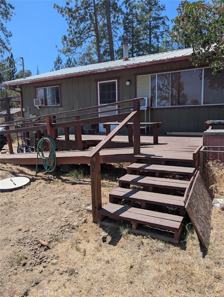 Well maintained 2br 1 BA home in Lush Meadows community. Enjoy the mountain life with wildlife, private lake, and privacy. Home has a new metal roof(3 years), wood stove, new kitchen cabinets and countertops, completely remodeled bathroom, bamboo flooring in kitchen, kitchen, main bedroom, bath and deck painted in last year, and a semi attached insulated garage that can be used as a she-shed, mancave, or storage. Power outage?? No problem! Just fire up the generator and you're back in business. There is a storage shed and a covered area for your firewood. Priced to sell in one of Mariposa's most sought after communities. HOA fee only $150 a year! Call to view today before it's gone. Seller motivated!