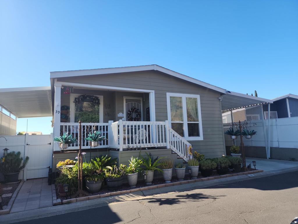 Beautiful & Modern 2022 Manufactured Home in Los Coches Mobile Home Estates! This spacious and stylish 3-bedroom, 2-bath home offers 1,493 sq. ft. of comfortable living in the serene and well-maintained Los Coches Mobile Home Estates, a desirable all-ages community. Built in 2022, the home features an open-concept layout with generously sized guest bedrooms, and a private primary suite complete with a large walk-in closet and en-suite bathroom. Situated on a private lot in a quiet cul-de-sac, the home is fenced on three sides for added privacy and includes a beautifully landscaped yard with a peaceful side patio—perfect for morning coffee or relaxing afternoons. The extended driveway fits up to 3 vehicles, and three newer storage sheds provide plenty of extra space. Community amenities include an inground pool, hot tub, clubhouse, BBQ/picnic area, playground, and basketball court—ideal for recreation and entertaining. Centrally located near Highway 8, schools, shopping centers, and restaurants, this home offers convenient access to everything you need.