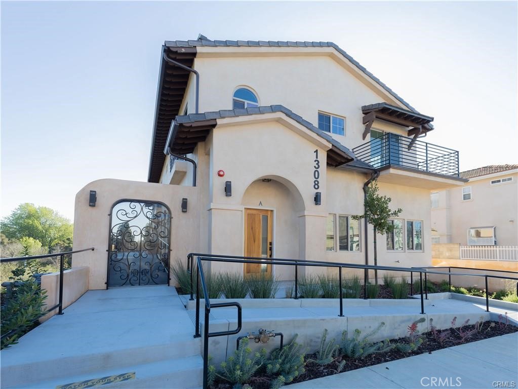 Discover your Spanish-inspired retreat tucked away behind the San Gabriel Hilton with panoramic views of the valley and Vincent Lugo Park. Step inside and enjoy a sun-filled, open-concept layout that seamlessly connects the living, dining, and kitchen areas—perfect for both gatherings and daily living.
Upstairs, a private balcony showcases sweeping views of the mountains and park, the perfect backdrop for your morning coffee or evening unwind. Downstairs, a private patio offers a cozy spot for dining al fresco or simply relaxing outdoors. With 3 spacious bedrooms and 3 bathrooms (primary en-suite bedroom), this home is designed with both comfort and function in mind. Located primarily near popular restaurants and shopping destinations, the home balances accessibility with the calm of a secure, gated community. Added conveniences include two reserved parking spaces, complete with EV charging capability. Blending timeless Spanish architecture with modern amenities, this home delivers style, comfort, and views that truly elevate everyday living. Don't miss out!