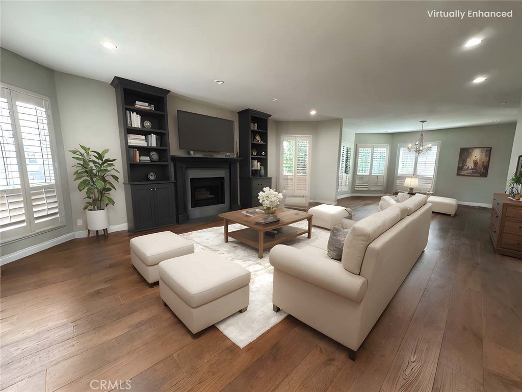 Incredible opportunity in the heart of Toluca Lake! This beautifully updated 3-bedroom, 3-bath single-level condo is a rare front-facing end unit on the second floor, offering both privacy and space in a highly desirable location. Inside, you'll find hardwood flooring, recessed lighting, dual-pane windows, updated HVAC, and a renovated kitchen featuring marble countertops, stainless steel appliances, and modern cabinetry. All three bathrooms have been tastefully updated as well. The HOA covers earthquake insurance, hot water, and current building improvements already in progress, adding future value and peace of mind. The spacious layout includes a warm and welcoming living room with a mantled fireplace and wet bar, plus a large dining area perfect for hosting. Step outside to the oversized balcony—ideal for morning coffee or relaxing with a book. One of the guest bedrooms doubles as a home office or den with its own bath. A second guest suite also features an updated bath and balcony access. The primary suite offers ample closet space, balcony access, and a large en-suite bath with dual sinks and a soaking tub. Additional perks include two side-by-side parking spots, extra storage, a community pool, and a meeting room. In close proximity to Toluca Lake Village shops, dining, and more!