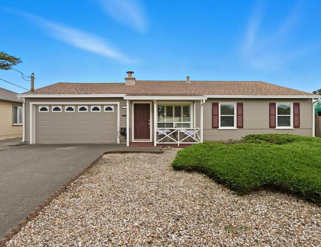 Located in the established Pacific Manor neighborhood, this 4-bedroom, 2-bathroom home offers a functional layout and a convenient coastal location. Step inside to a warm living room featuring a large picture window and classic brick fireplace, perfect for cozy evenings. The open kitchen includes Corian countertops, white cabinetry, tile flooring, and an eat-in area. Three bedrooms and an updated full bathroom are located at the front of the home. A large family room sits just off the kitchen, providing a great space for relaxing. The fourth bedroom, with a walk-in closet and a second full bathroom, is adjacent to the family room. The backyard is a blank slate, ready for you to create your own ideal outdoor space. Additional features include an attached 2-car garage, dual-pane windows, and plantation shutters throughout most of the home. With approximately 1,510 square feet, this home is close to beaches, trails, shopping, and public transportation.
