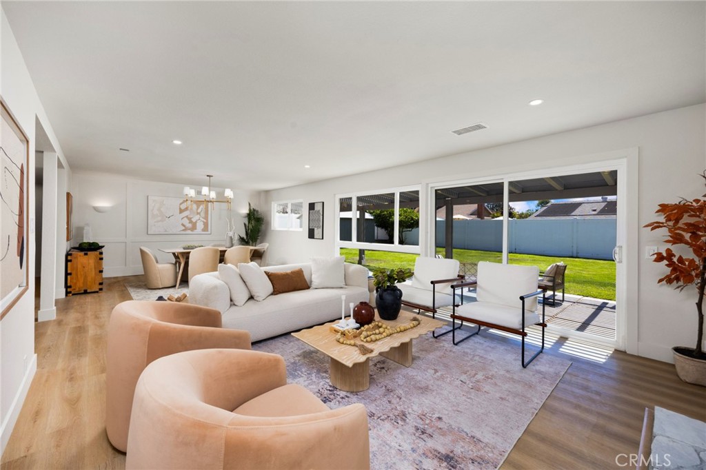 Welcome to 25112 Vespucci — an impeccably renovated 4-bedroom, 3-bath home offering 2,550 square feet of thoughtfully redesigned living space. Every detail has been curated to include the modern conveniences you want, plus a few you may never have imagined.
The main floor features a desirable full bedroom and bath, perfect for guests or multi-generational living. Custom storage solutions are abundant, including nooks, built-in hooks, and a SoCal-inspired mud-room area to keep everyday life organized.
The heart of the home is the impressive kitchen, where warm white oak cabinetry pairs beautifully with a bold black island, creating a striking contrast. The island offers plenty of seating, a microwave drawer, and a wine fridge. A commercial-style designer range anchors the space, complemented by abundant counter space for cooking and entertaining. A built-in bench with storage forms a charming eat-in nook, adding warmth and function to the room.
Open to the kitchen, the living room centers around a beautiful stone fireplace, creating a warm and inviting gathering space. Just beyond, the dining room is perfectly positioned for both casual meals and special occasions. The living and dining areas flow easily to the covered patio and the flat, usable, fully fenced backyard. With room for a pool, a storage shed, and mature fruit trees, it’s a versatile outdoor space ready for relaxation or play.
Upstairs, the primary suite is a true retreat with large windows, a spacious walk-in closet, and a striking spa-inspired bathroom. The “wet-room” design blends a freestanding soaking tub and oversized shower into one seamless space, complete with a generous built-in bench. Cream-toned zellige tiles bring warmth and texture, complemented by oversized tiles with elegant stone veining that extend from the floor up two walls for a striking, cohesive look.
Two additional bedrooms, another full bath, and a well-appointed laundry room round out the upstairs. A bonus lounge space — carved from a reclaimed attic area — offers flexibility for a reading corner, play space, or pet nook.
Every inch of 25112 Vespucci has been reimagined to welcome you, your family, and your pets into a space where comfort meets thoughtful design. Don’t miss your chance to make this one-of-a-kind property your new home.